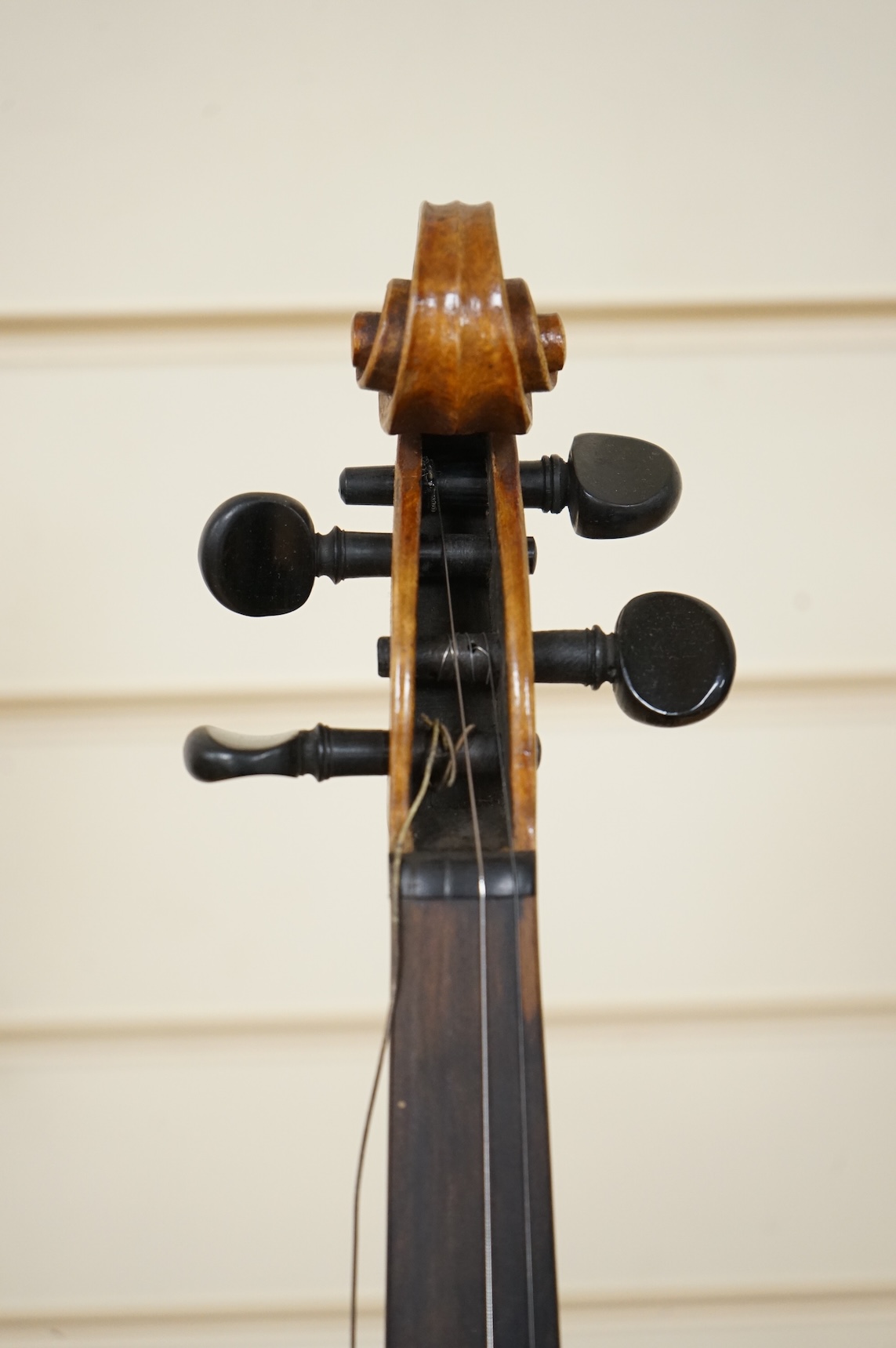 Four violins; a German Dresden violin, together with further two German violins, and a Saxony violin, three in cases or the remains of cases.